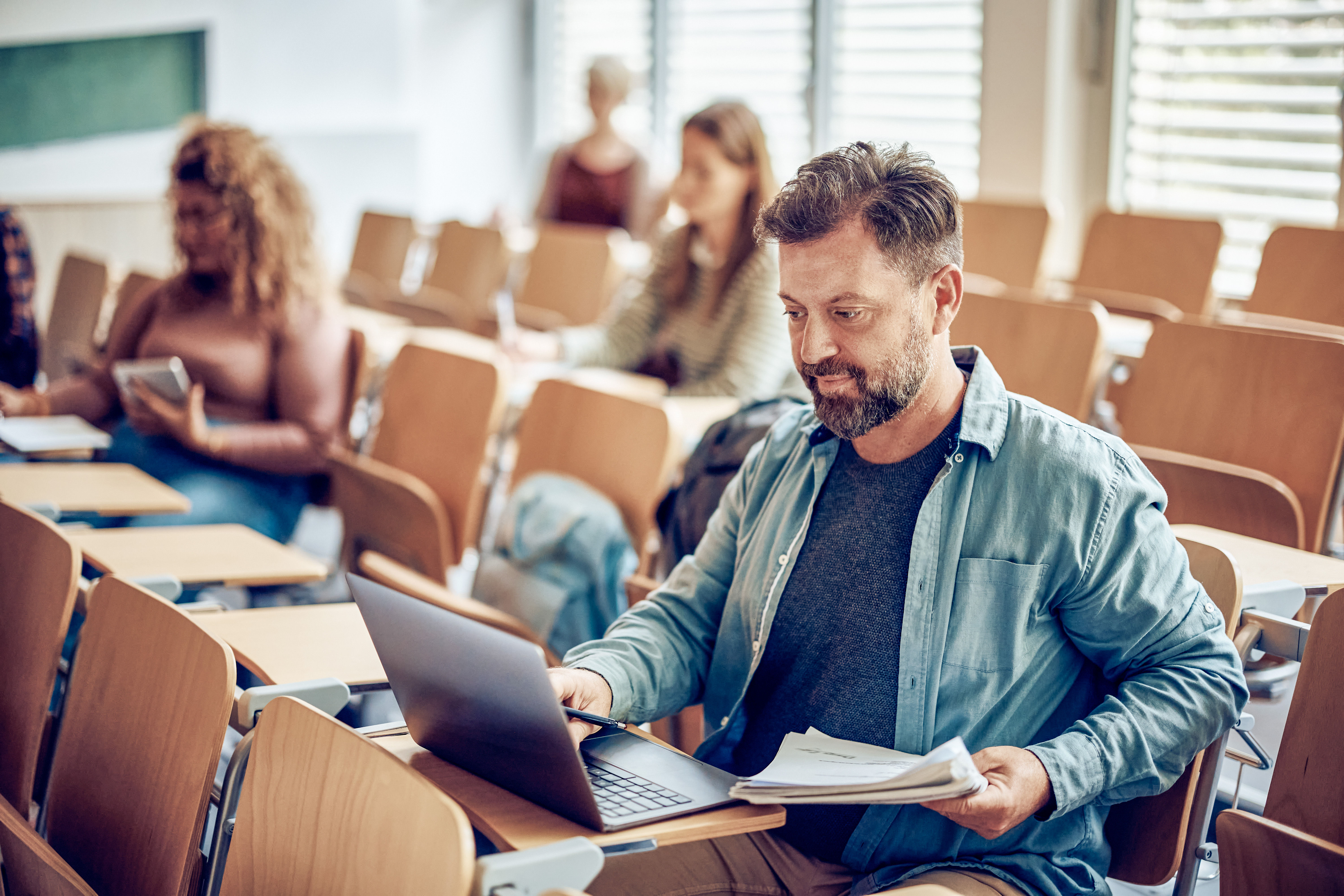 Man Learning On Laptop During A Lecture